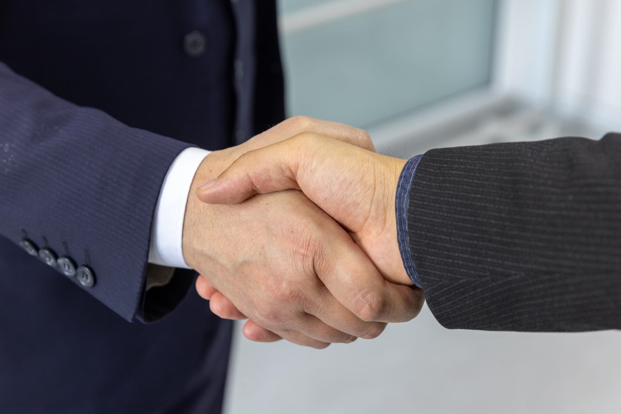 Two business people shaking hands