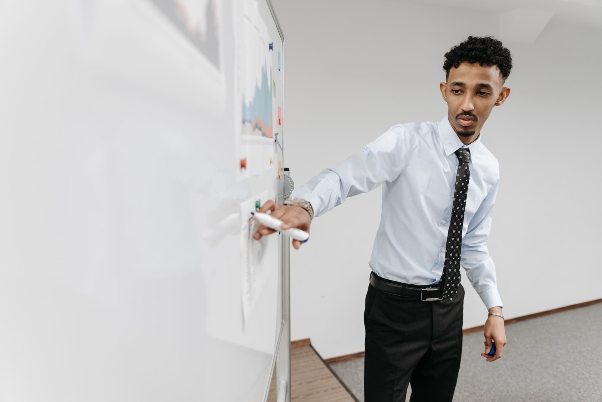 A founder presenting at a whiteboard